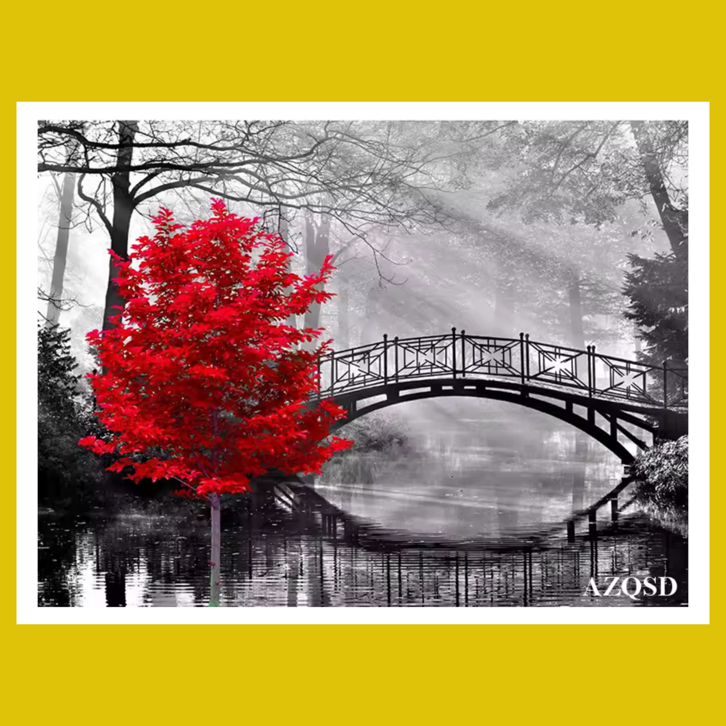 Red tree by a bridge over water