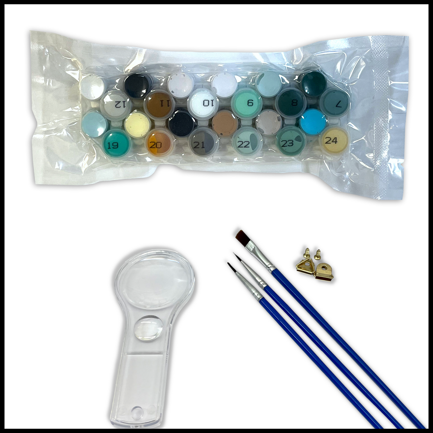 Set of paint colors with a magnifying glass and brushes on a white background