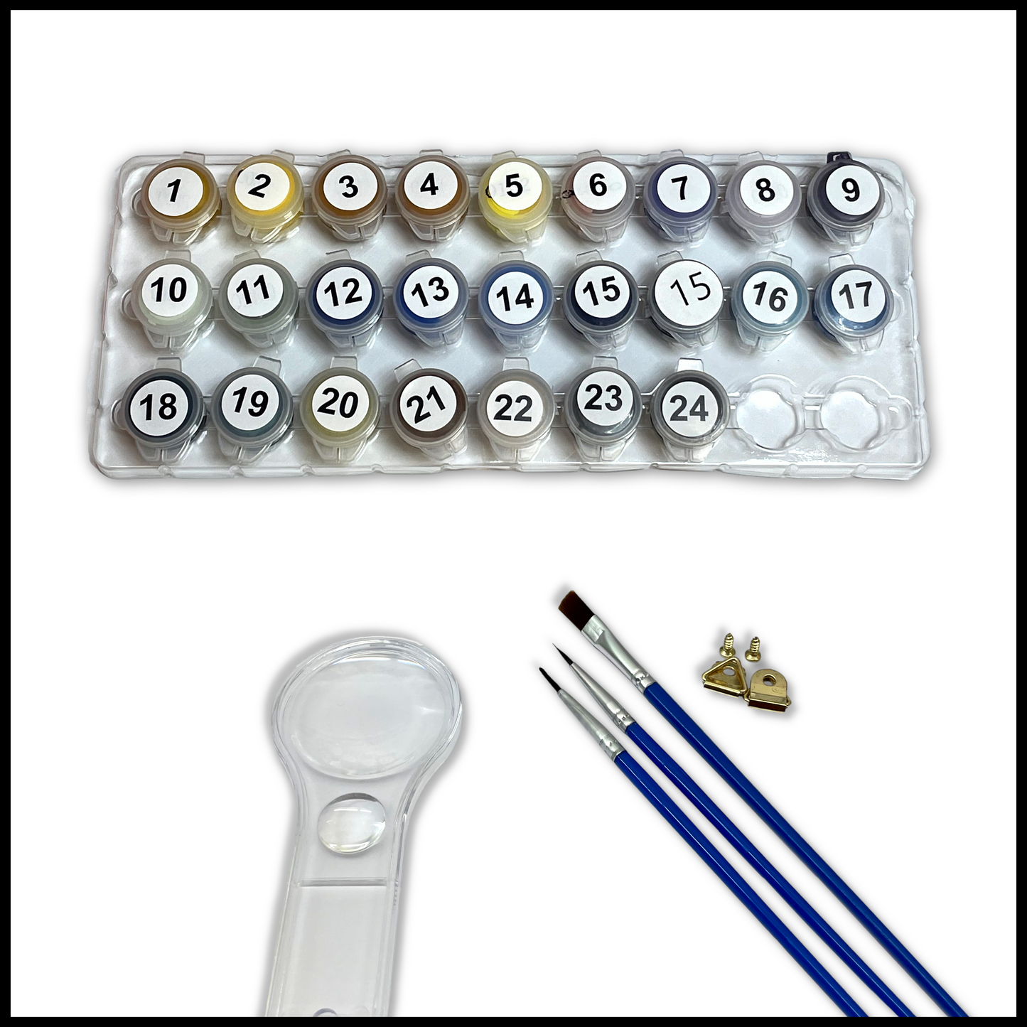 Set of paints with a magnifying glass and brushes on a white background