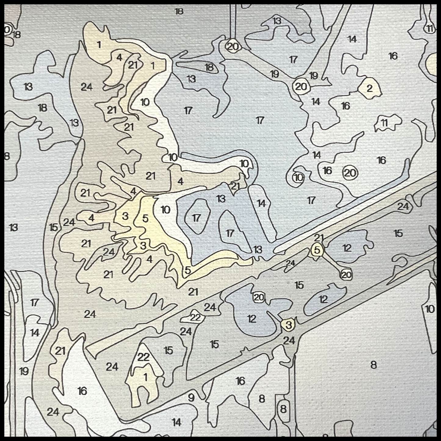 Close up of canvas showing numbered areas to paint