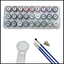 Set of paints, brushes and a magnifying glass