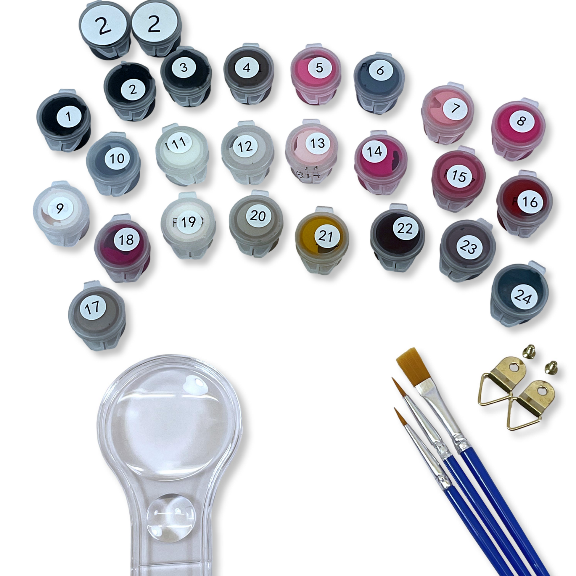 Set of small containers with paint colors and painting tools on a white background