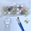 Set of paint poys in a clear plastic package with paint brushes and a magnifying glass on a white background.