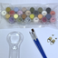 Set of paint pots, paint brushes, and a magnifying glass on a white background.